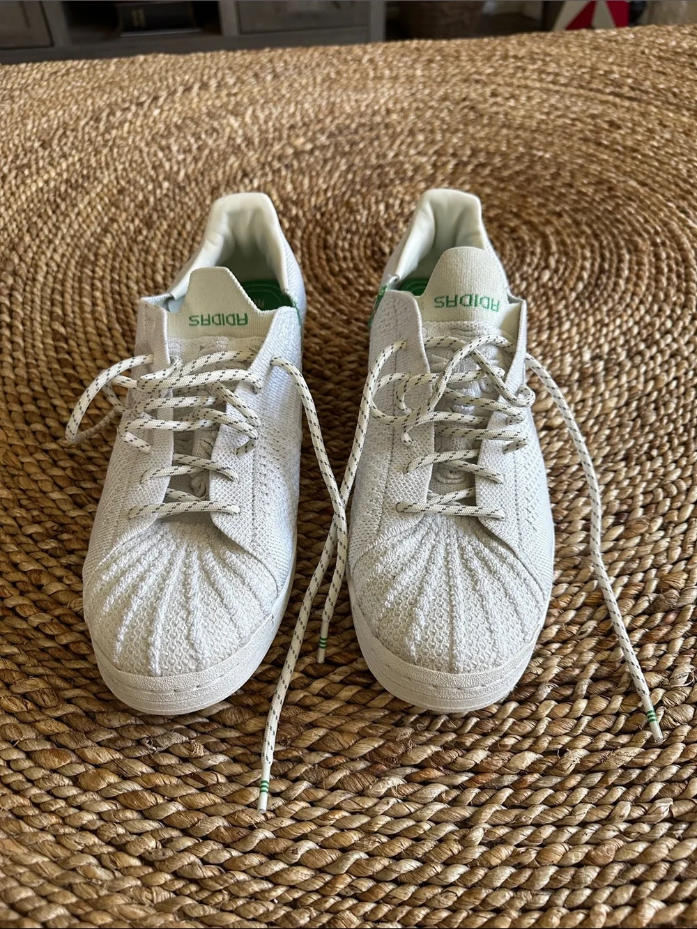 adidas men’s size 12  White Knit Sneakers with Green Tongue Logo